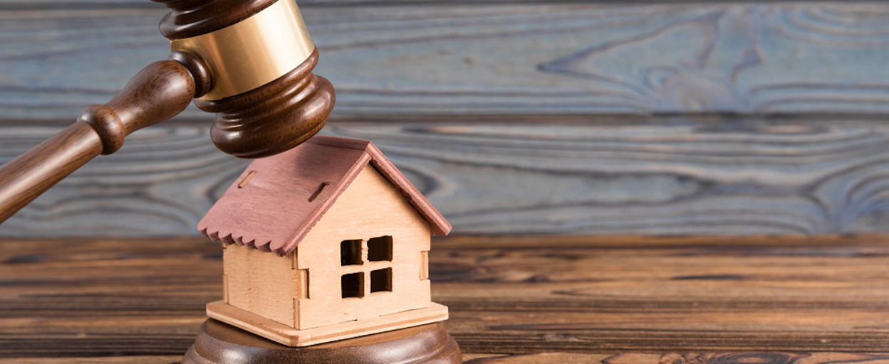 Gavel hitting model house